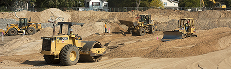 bulldozers grading construction site